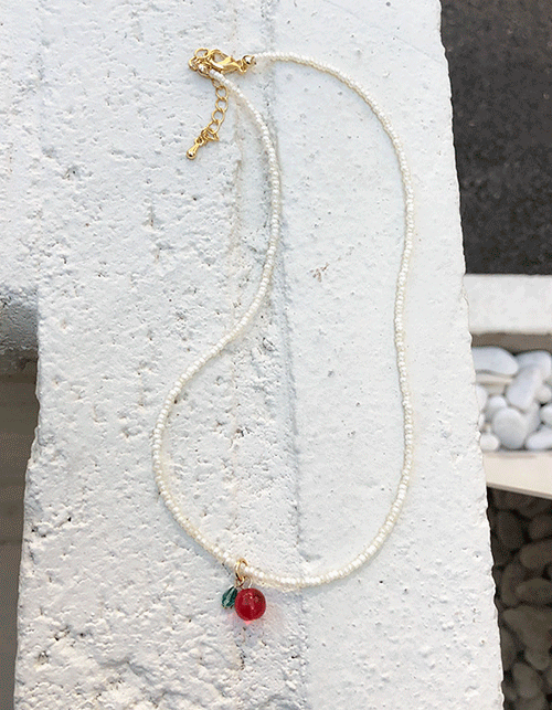 red fruit pearl necklace